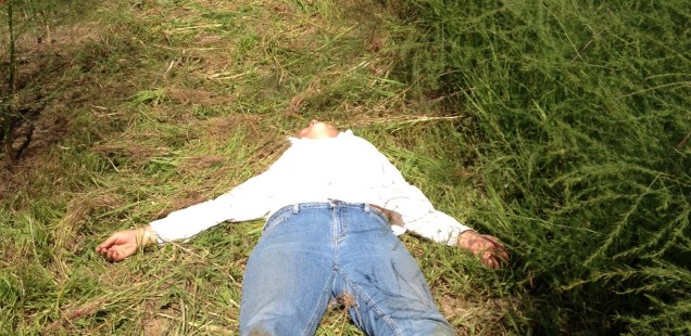 person laying on their back on the ground