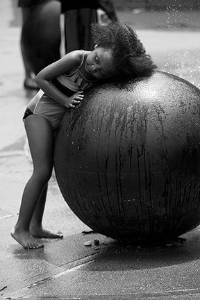 girl resting on a giant circle
